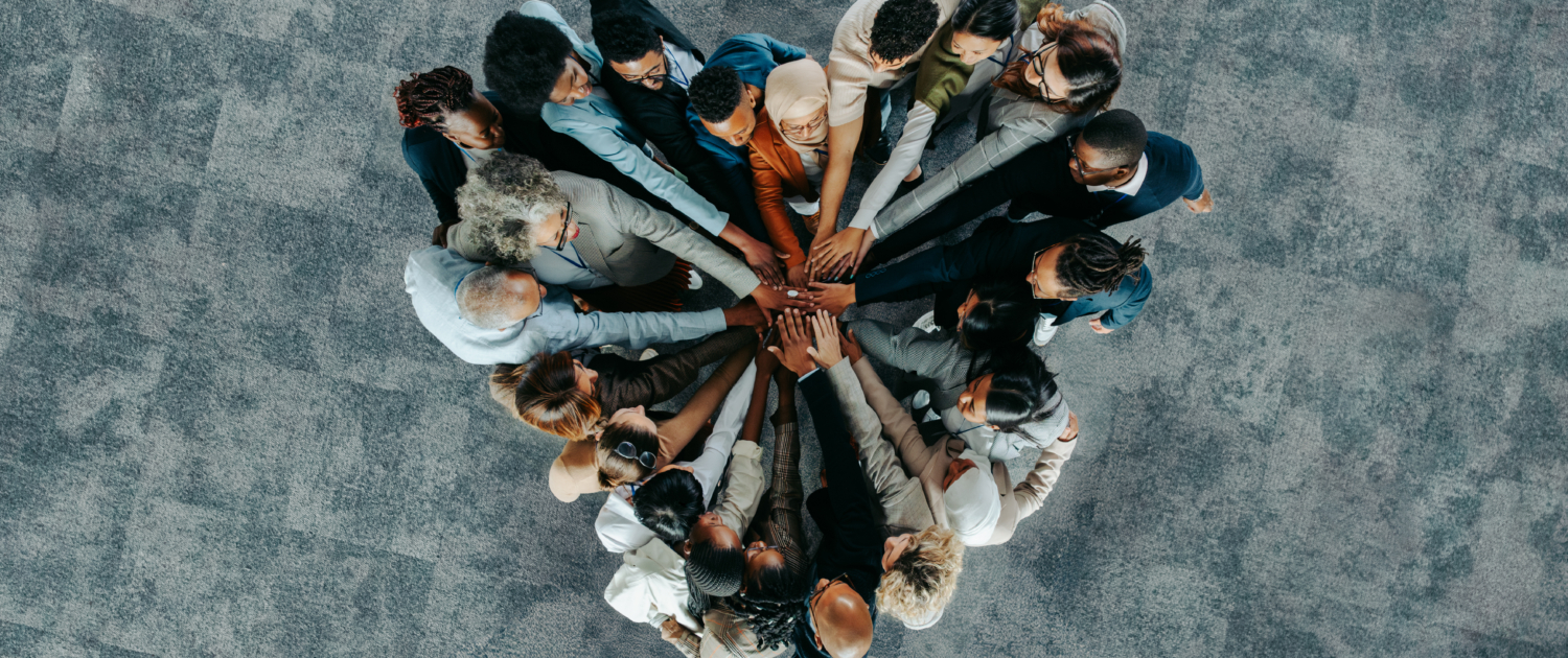 Top view of a a heart shape of people, showing unity and teamwork